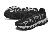Pair of black Nike Air Max DN 8 Paris sneakers viewed from above and at an angle.