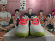 Front view of grey Nike basketball shoes with coral laces and lime green soles