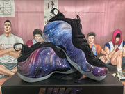 Angled view of the pair of galaxy-patterned sneakers with black uppers and translucent outsoles