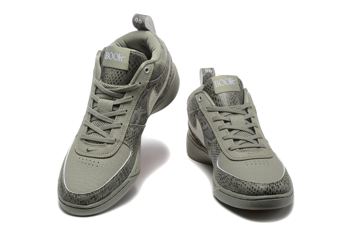 Pair of grey patterned Nike Book 1 sneakers shown from the front