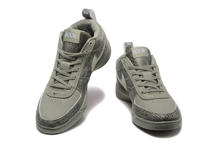 Pair of grey patterned Nike Book 1 sneakers shown from the front