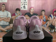Rear view showing the padded pink collars, gray heel panels, and printed heel graphics.