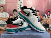 Pair of white, teal, red, and black basketball shoes displayed at an angle