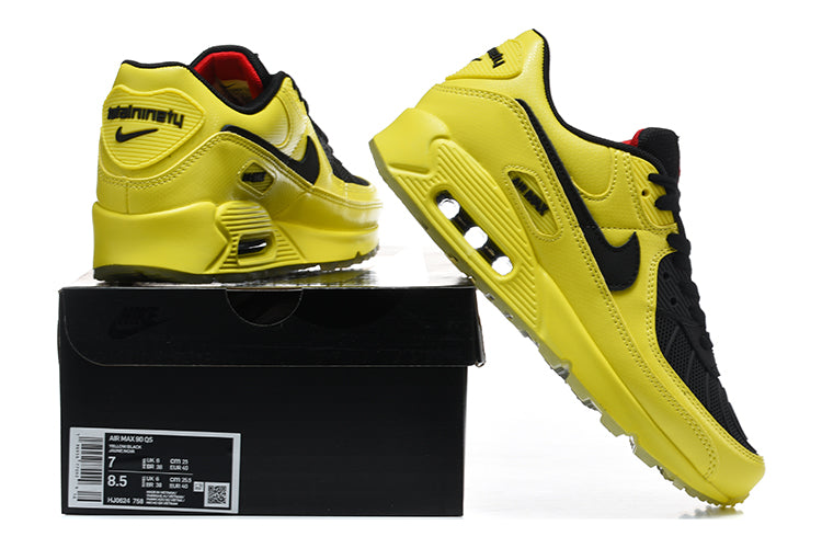Yellow and black Nike Air Max 90 sneakers shown on a box; the box label shows a sample size.