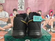 Rear view of black basketball sneakers showing padded collars, gold accents, and visible Zoom heel markings.