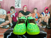 Front view showing the raised textured pattern, black laces, padded collars, and bright green colorway.