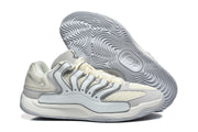 Side and outsole view of the Nike KD sneakers, showing layered overlays and the wavy tread pattern.