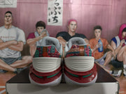 Rear view of the pair highlighting the multicolor patterned heel panels and layered red, green and white heel construction.