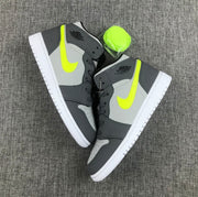 Top-down view of the pair showing fluorescent side accents, grey panels and white outsoles.