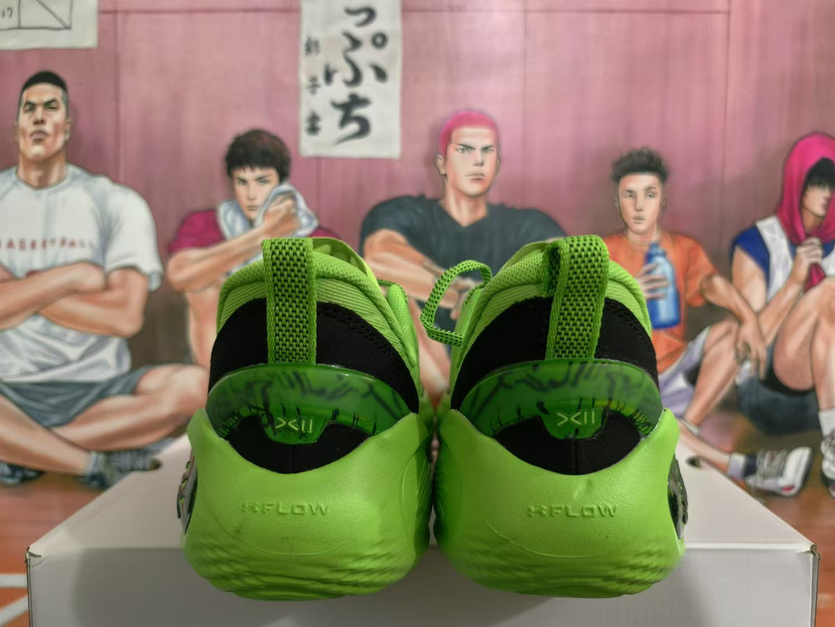 Rear view of green basketball sneakers showing padded collars, black heel panels, and translucent outsole details.