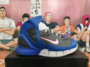 Side profile of a blue and gray Nike Zoom Kobe 2K5 basketball sneaker