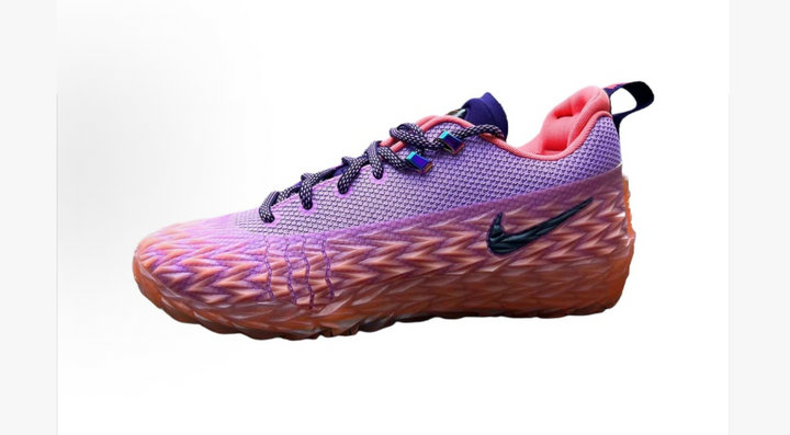 Side view of purple and orange Nike low-top sneakers with dark laces, a contrasting swoosh, and pink lining.