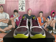 Front view of the pair showing burgundy and black toe panels, burgundy laces, white uppers, and neon green outsole sections.