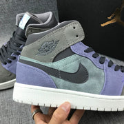 Close-up of the collar, wing logo, black Swoosh, and layered gray and purple panels.