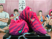 Angled view of pink and purple basketball shoes with teal side Swoosh