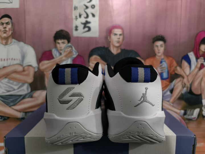 Rear view of black, white, and blue Jordan Luka basketball shoes with contrasting heel logos