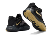 Black and gold Nike Giannis Immortality 7 basketball shoes, including outsole view