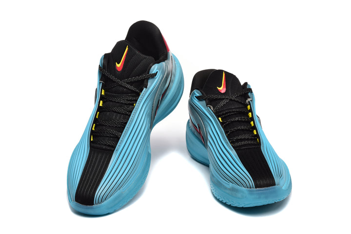 Pair of blue and black Nike sneakers shown from the front with red and yellow accents.