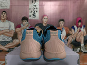 Rear view showing the peach heel panels, stitched detailing, and “12 AM” lettering on the heel tabs.