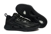 All-black Nike basketball sneaker with a black textured outsole displayed underneath.
