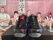 Front view of the sneakers showing black laces and contrasting tongue details