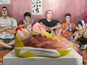 Side view showing pink uppers, yellow outsole details, and a white midsole