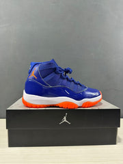 Single side profile of the blue high-top sneaker displayed on a black Jordan shoebox.