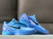 Two blue Kobe 6 shoes displayed together, highlighting the textured uppers and translucent heel sections.