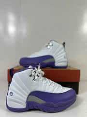 Close-up side view of a white and purple Air Jordan 12 Retro