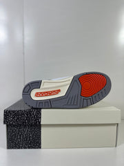 Outsole view showing grey tread, a red circular traction section, and Jordan branding.