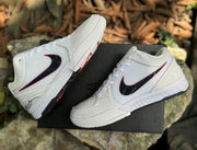 Pair of white Kobe 4 shoes shown from angled side views