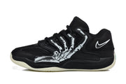 Side profile of a black Nike KD basketball shoe with a skeleton graphic and pale outsole.