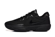 Side profile of one black sneaker showing the low-top shape, tonal side mark and layered sole.
