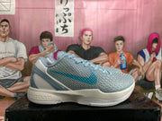 Side view showing the textured upper and blue accents