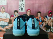 Rear view of the pair showing QUAI54 heel branding, blue uppers, and Jordan Jumpman logos.