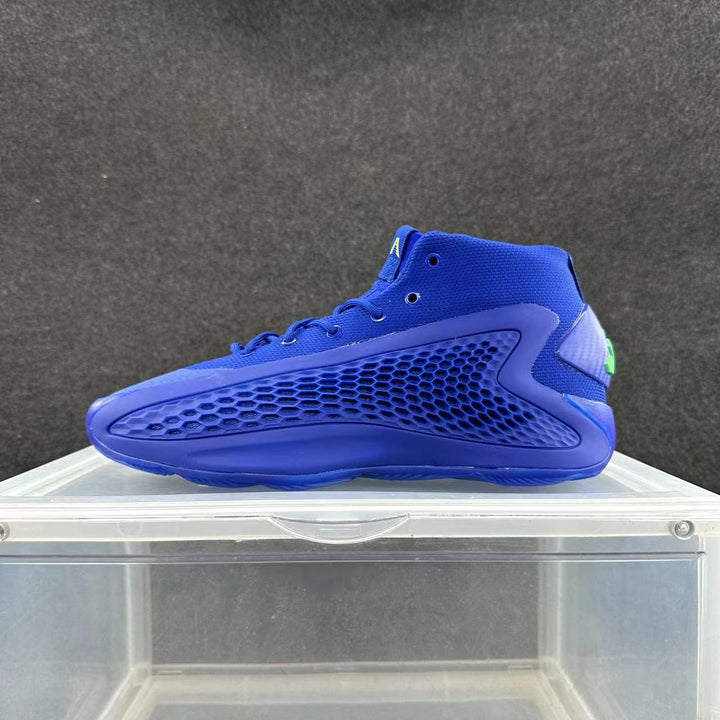 Side view of a blue high-top basketball sneaker with perforated honeycomb-pattern side panels and a green heel accent.