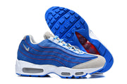 Nike Air Max 95 TT sneakers shown from the side and underneath, with a blue outsole.