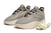 Pair of brown-gray low-top sneakers shown from above with mesh panels, lace closures, and cream outsoles.