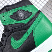Close-up of the textured green ankle panel, black Swoosh, and stitched construction.