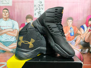 Angled view showing the black textured upper, padded collar, layered side overlays, and rubber outsole.