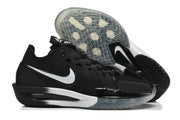 Side view of the black Nike basketball shoe alongside an outsole view.