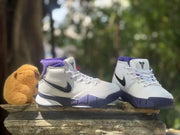 Front three-quarter view of the pair with Kobe logos on the tongues