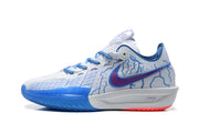 Side profile of a white and blue sneaker with a purple Nike swoosh, patterned panels, and blue outsole.