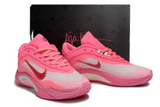 Pair of pink Nike A'ja Wilson 1 shoes displayed in front of a black shoebox.