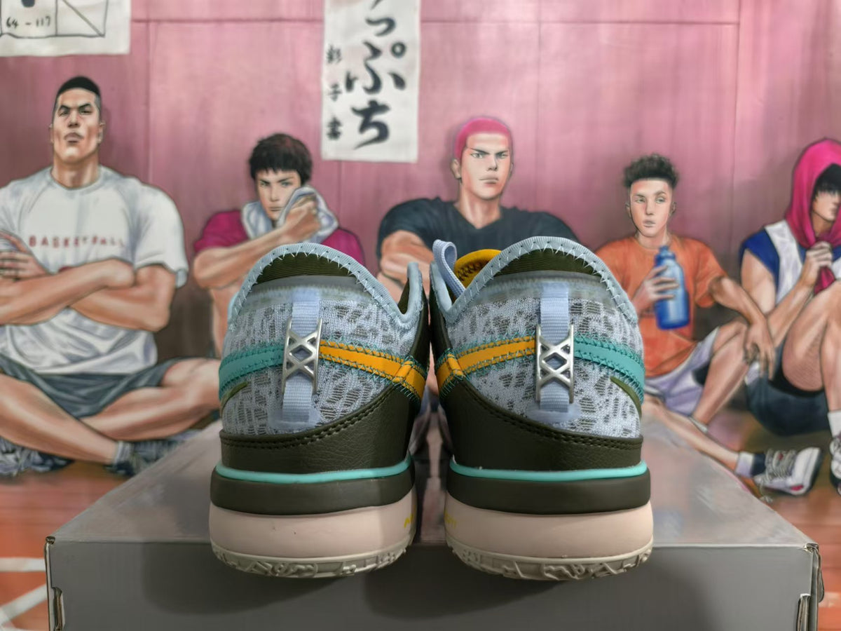 Rear view of light blue Nike basketball shoes with teal trim, dark heel panels, and yellow accents