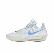Side view of a white Nike GT Cut 3 sneaker with a bright blue Swoosh, pastel lace accents, and a mostly translucent outsole.