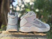 Rear and side view of the pair, showing Nike heel branding, padded collars, and layered sole construction.