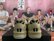 Rear view showing black heel accents on beige basketball shoes
