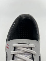 Top-down close-up of the black perforated toe and white laces