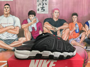 Side view of a black slide showing raised AIR-style lettering, perforated panels, and a white midsole.